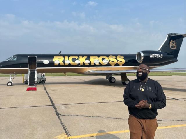 Rick Ross shows off his new private jet, which has his name embossed in gold on the side