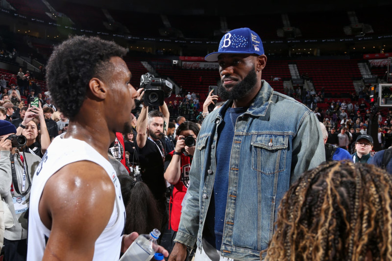 PORTLAND, OR - APRIL 8:  LeBron James talks with Bronny James #6 of Team USA during the 2023 Nike Hoop Summit on April 8, 2023 at the Moda Center Arena in Portland, Oregon. NOTE TO USER: User expressly acknowledges and agrees that, by downloading and or using this photograph, user is consenting to the terms and conditions of the Getty Images License Agreement. Mandatory Copyright Notice: Copyright 2023 NBAE (Photo by Sam Forencich/NBAE via Getty Images)