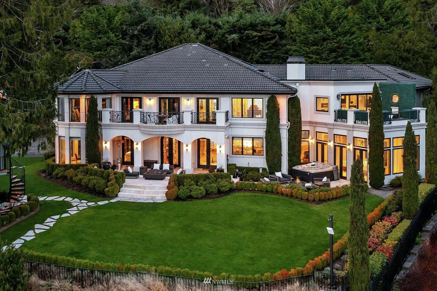 Seattle celebs Russell Wilson and Ciara put their massive Bellevue mansion  on the market for a whopping $36M.