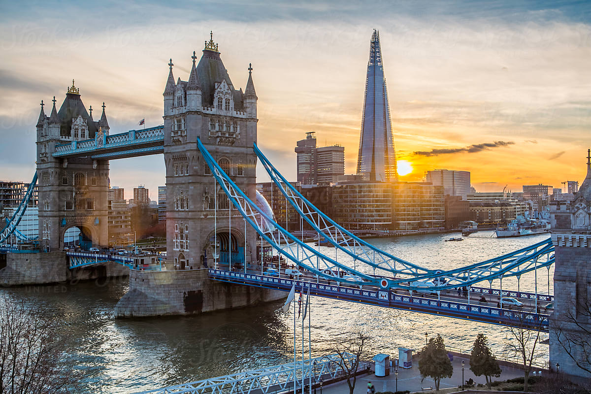 London, Tower Bridge And The Shard Along The River Thames" by Stocksy  Contributor "Gavin Hellier" - Stocksy