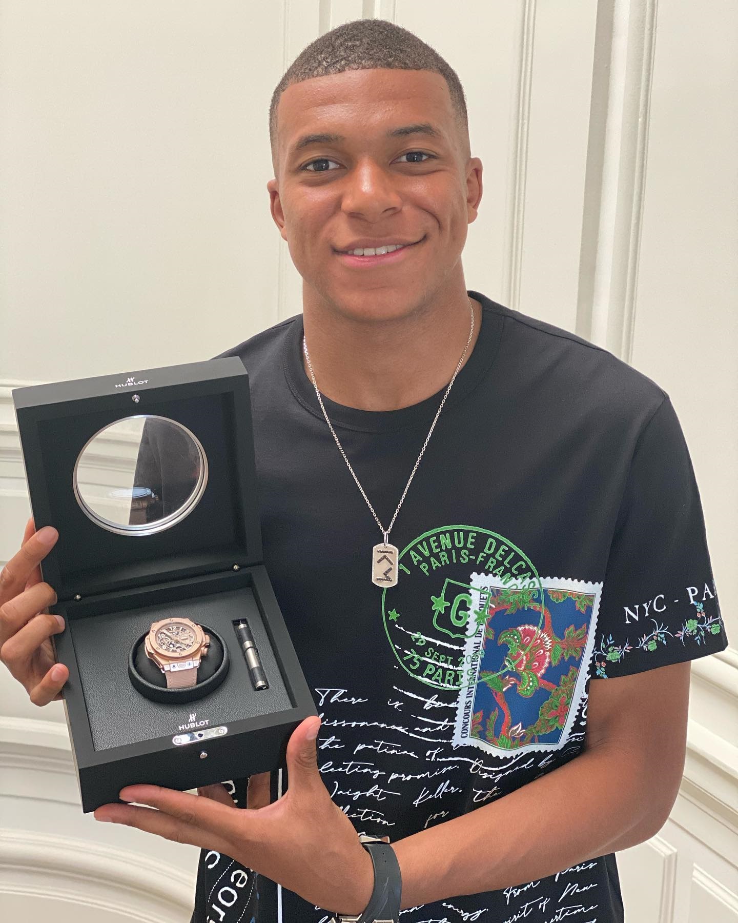 Mbappé holding a £48,900 Hublot Integrated King Gold watch