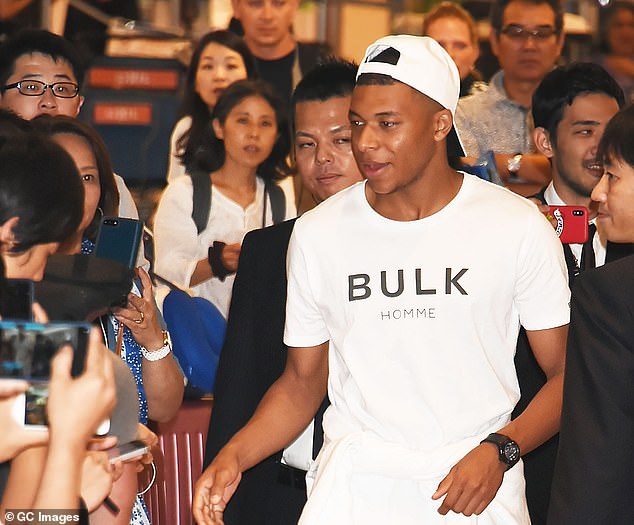 Mbappe was greeted by hundreds of fans as he made his way through the terminal