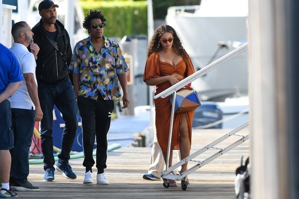 Walking several steps behind was Beyonce's beau Jay Z , who looked typically relaxed in a Hawaiian shirt and tracksuit bottoms