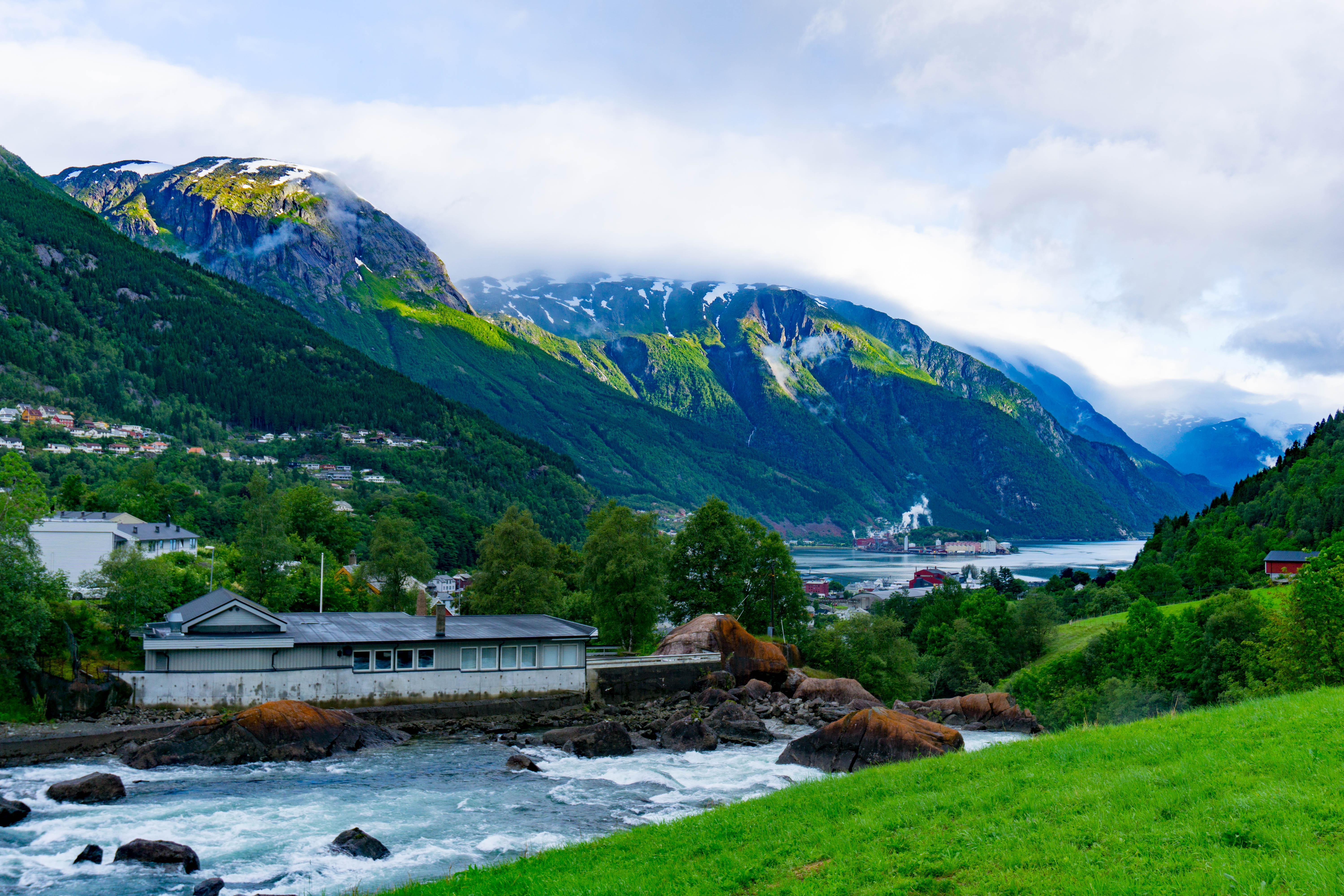 The gorgeous valley of Odda, Norway. No matter which way you look, you're  facing a lush, green mountain. Great place to stay if you're planning to  hike Trolltunga. : r/travel