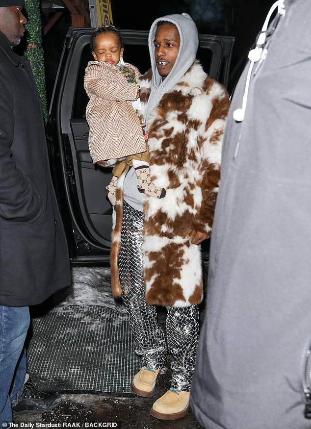 RZA was dressed in a white button-down and argyle vest for their family outing. Their son also sported tan slacks, Gucci socks and a chevron coat