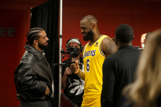 Drake and LeBron James of the Los Angeles Lakers talk after the NBA game between the Toronto Raptors and the Los Angeles Lakers at Scotiabank Arena...