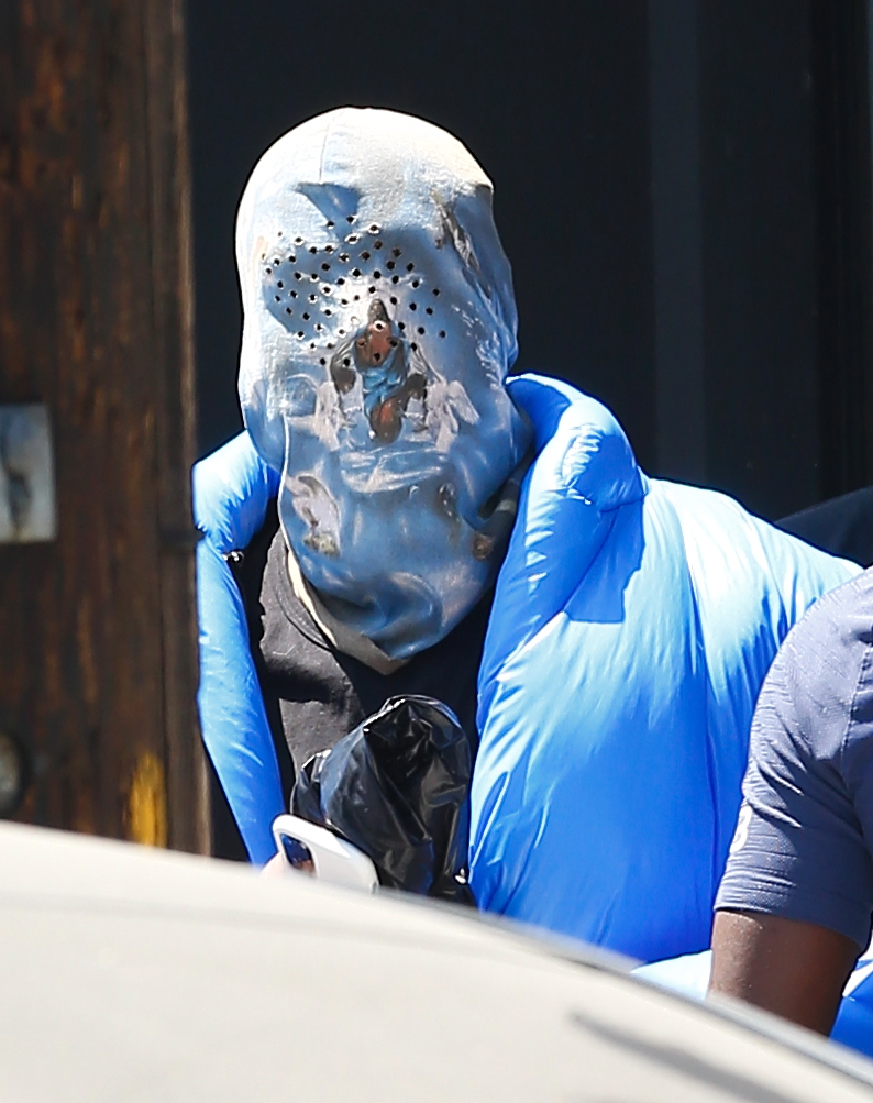 Kanye's mask featured two intricate images of Jesus Christ and some holes to breathe through