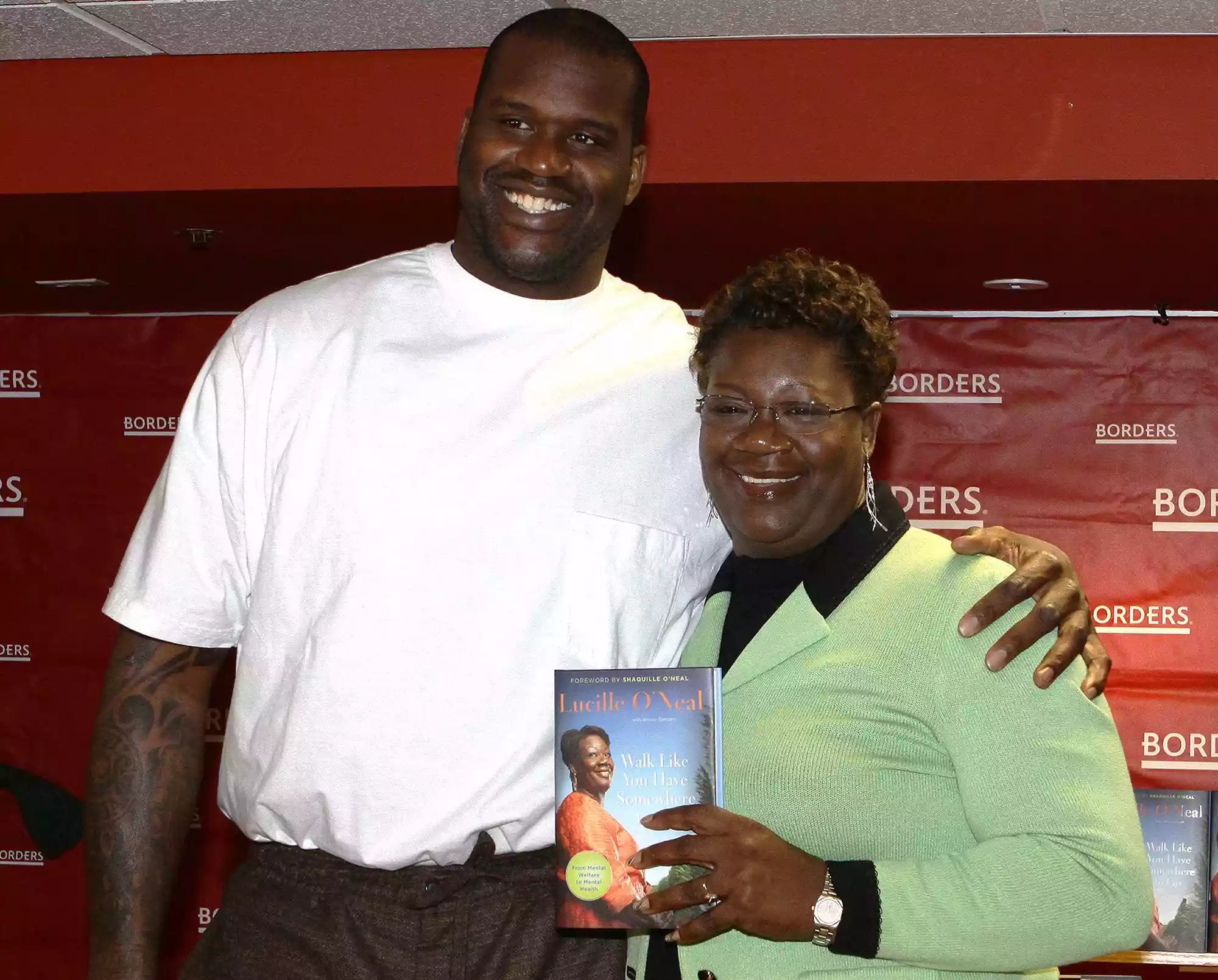 Shaquille and Lucille O'Neal poses for photos before signing copies of their book "Walk Like You Have Somewhere To Go" in Chicago, Illinois on April 7, 2010. 