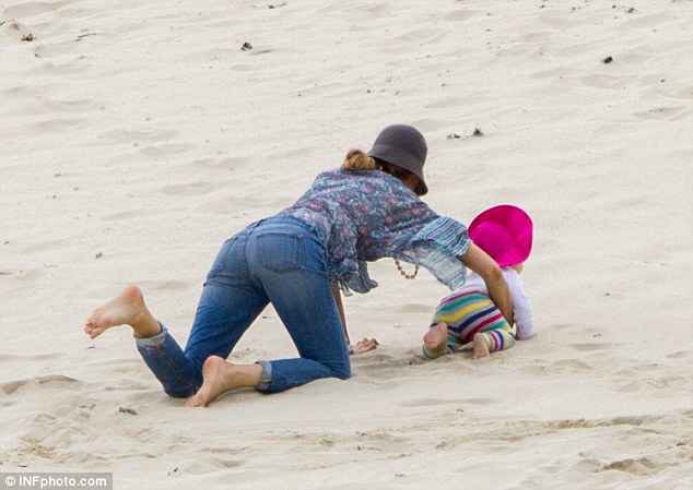 Not so fast! Blake scooped up her runaway crawler