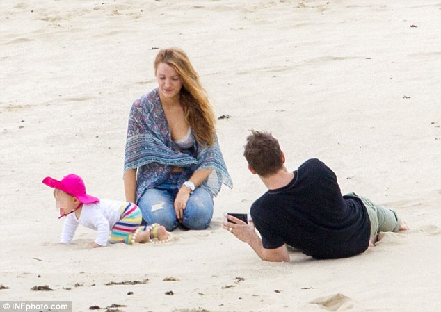 Great escape: James looked keen on exploring her new surroundings as her parents were locked in conversation