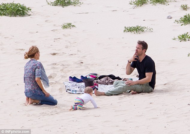 Playful: The couple appeared to be having the time of their life on the beach