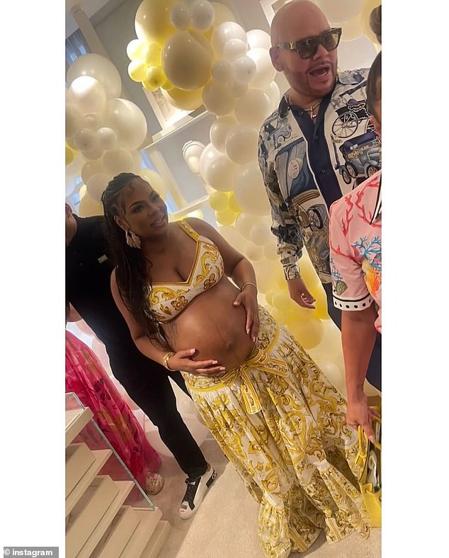 Photos from the fete show Ashanti proudly showcasing her baby bump in a yellow, gold and white ensemble inspired by an Indian lehenga. Nelly looked relaxed in a black golf shirt, pants and black and white sneakers