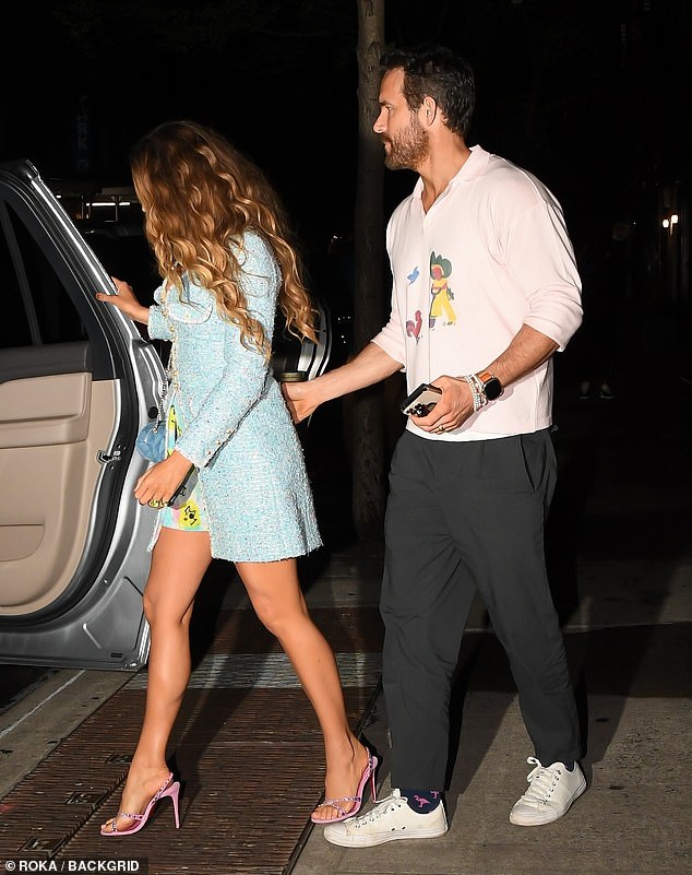 Ever the gentleman: Ryan, who has been married to Blake for over a decade and shares four children together, was pictured helping his wife get into their car following the dinner