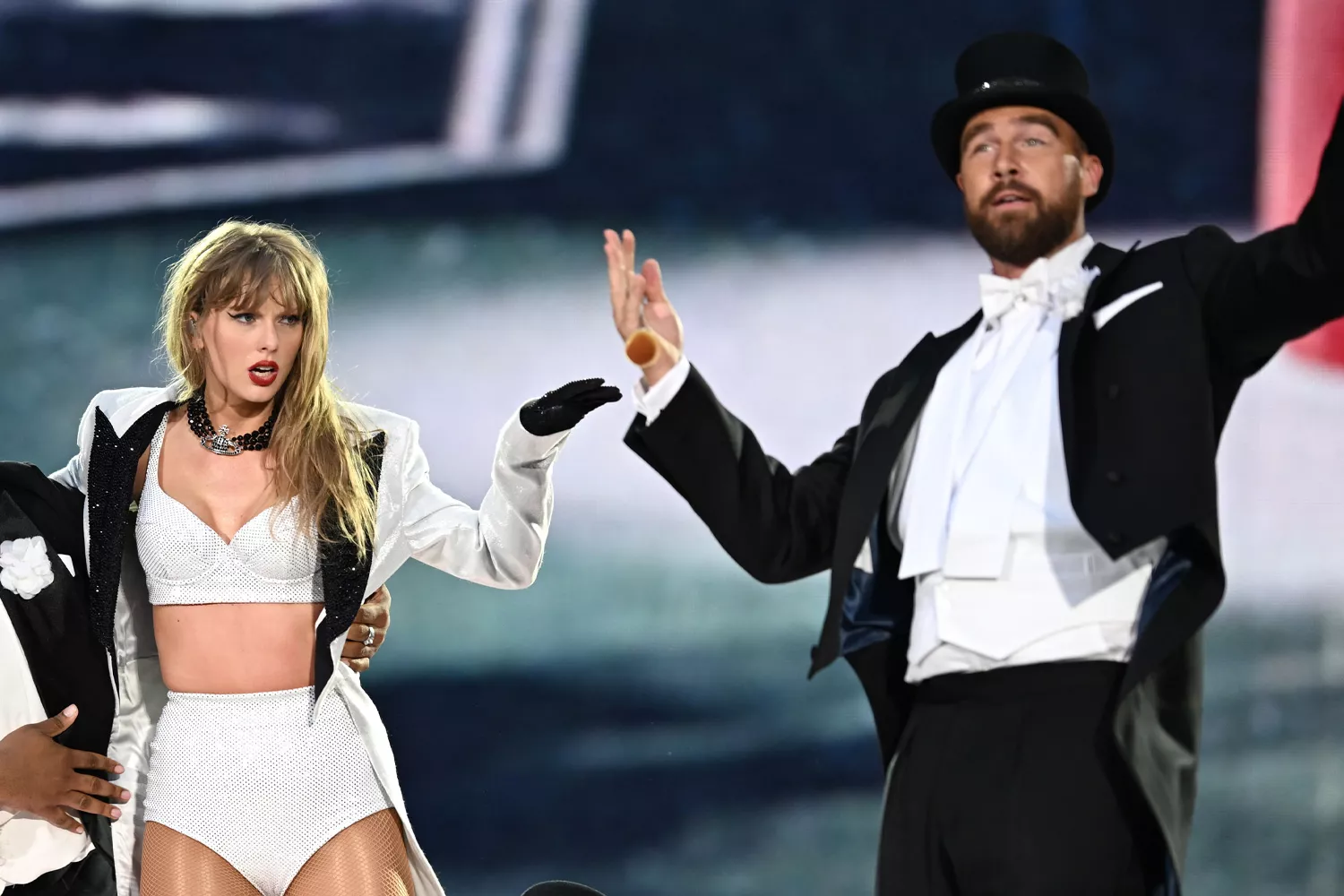 Taylor Swift is joined on stage by Travis Kelce (R), during "Taylor Swift | The Eras Tour" at Wembley Stadium on June 23, 2024 in London, England.