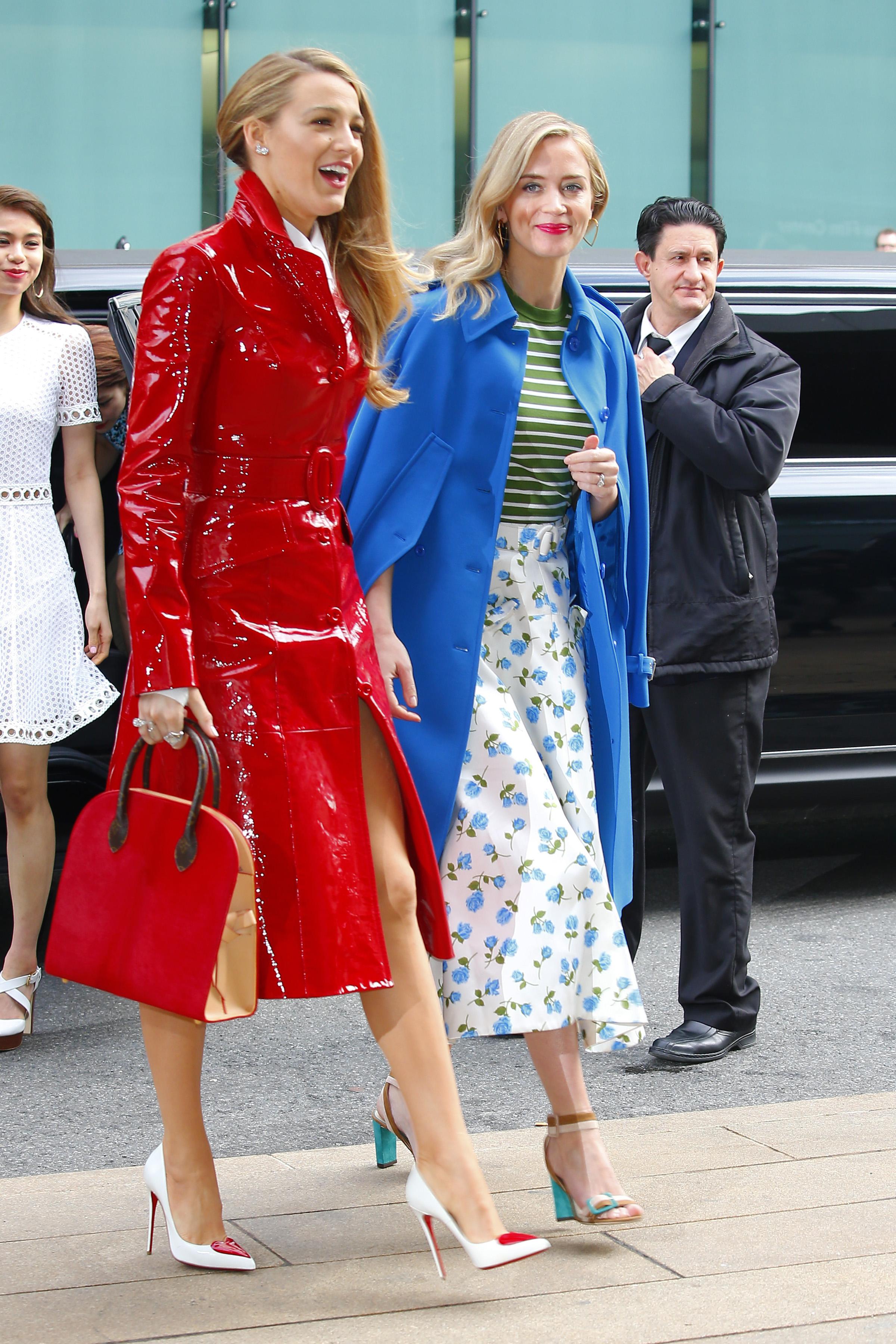  Emily wore a chic blue coat over a green and white stripey top and flowery midi-skirt