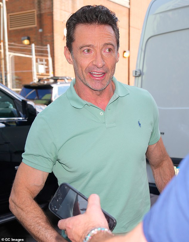 Jackman, 55, showed off his muscled arms in a mint green Ralph Lauren Polo shirt, which he paired with dark slacks