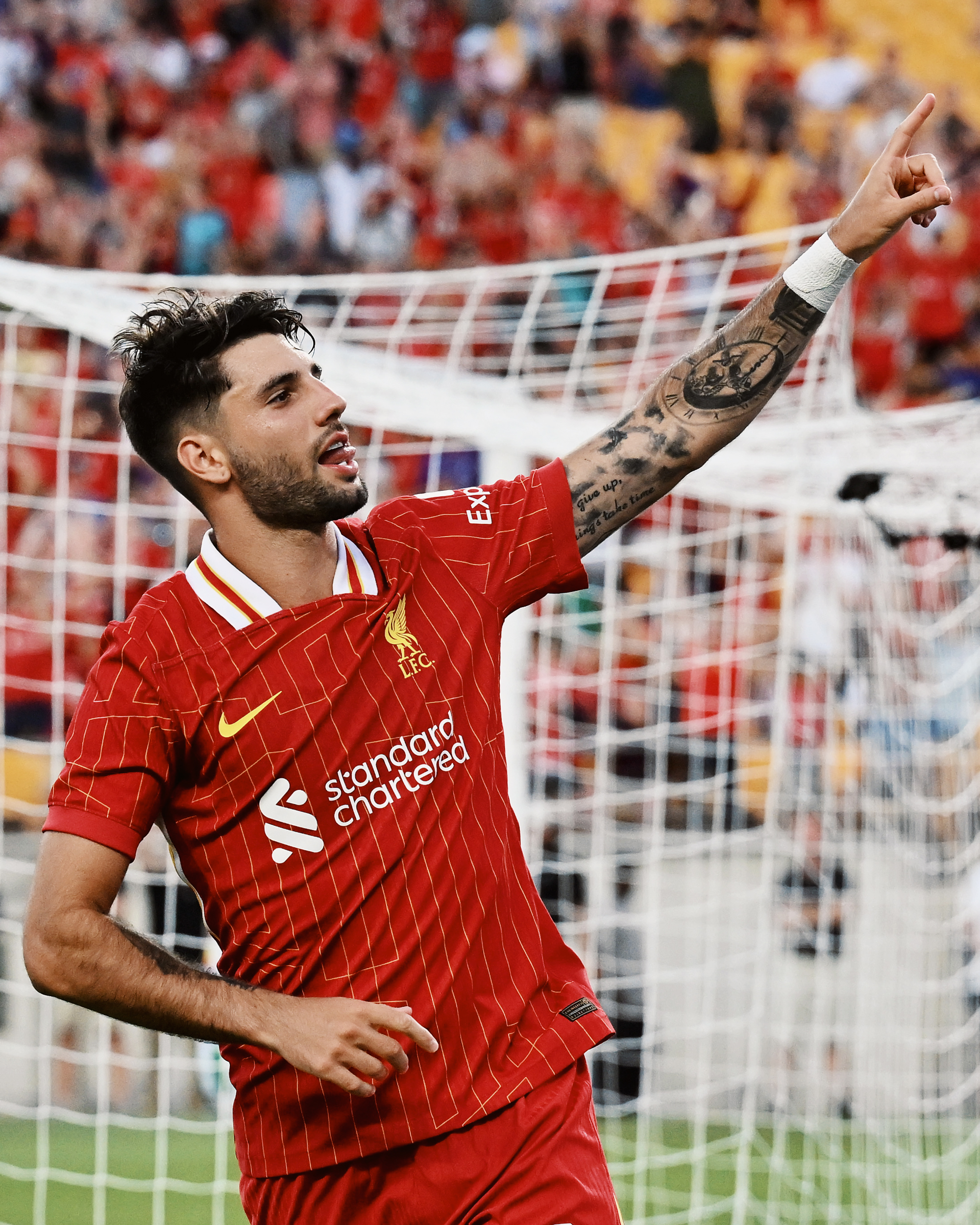 Photography of Dominik Szoboszlai celebrating his goal during Liverpool FC vs Real Betis.